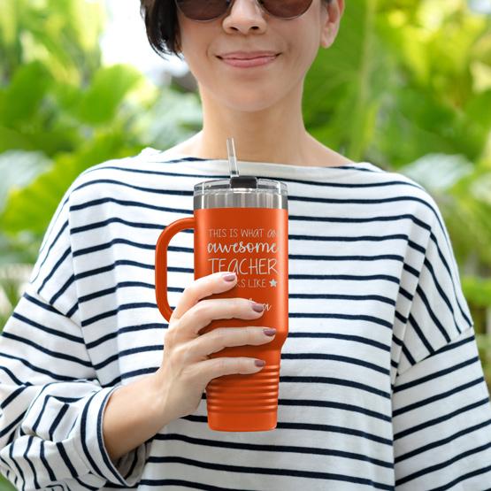 Custom Engraved 40 oz Orange Tumbler with Handle Held by Teacher in Sunglasses