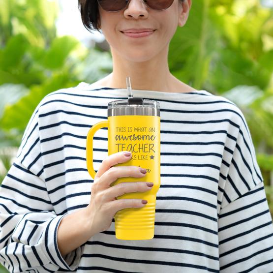 Custom Engraved 40 oz Yellow Tumbler with Handle Held by Teacher in Sunglasses