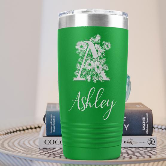 Custom Engraved 20 oz Green Tumbler on a side table with books