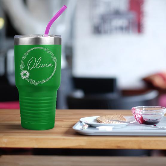 Custom Engraved 30 oz Green Tumbler on a table next to breakfast with a sample engraving for Olivia