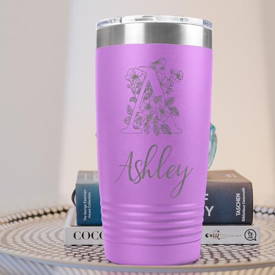 Custom Engraved 20 oz Light Purple Tumbler on a side table with books