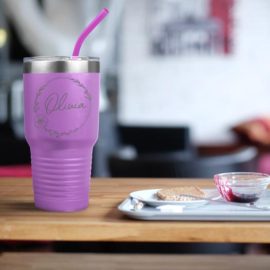 Custom Engraved 30 oz Light Purple Tumbler on a table next to breakfast with a sample engraving for Olivia