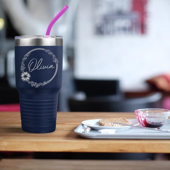 Custom Engraved 30 oz Navy Tumbler on a table next to breakfast with a sample engraving for Olivia