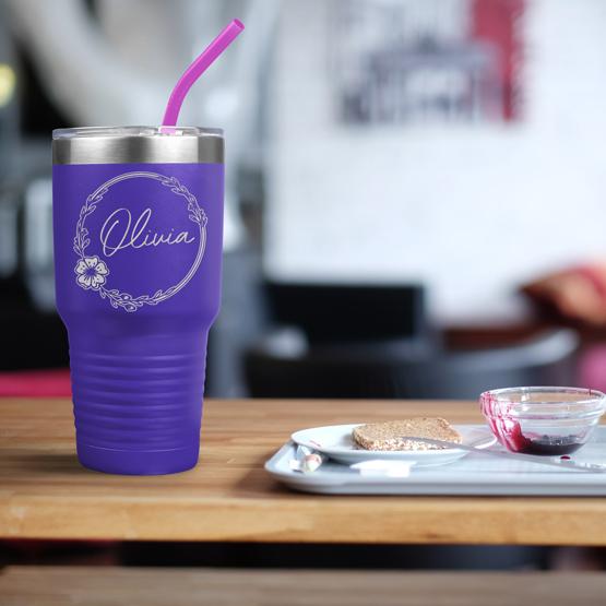 Custom Engraved 30 oz Purple Tumbler on a table next to breakfast with a sample engraving for Olivia