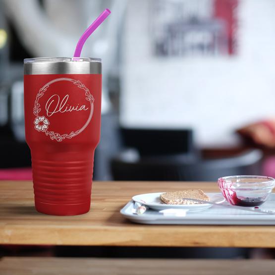 Custom Engraved 30 oz Red Tumbler on a table next to breakfast with a sample engraving for Olivia