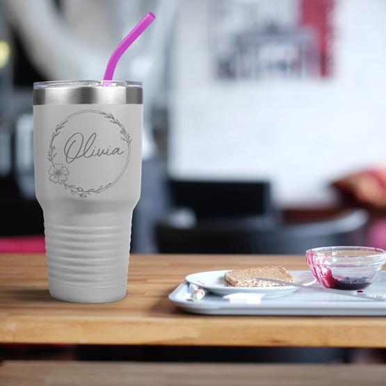 Custom Engraved 30 oz White Tumbler on a table next to breakfast with a sample engraving for Olivia