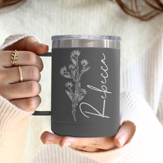 Custom Engraved 15 oz Gray Tumbler Mug being held by a woman with a sample engraving for Rebecca