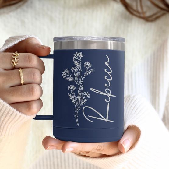 Custom Engraved 15 oz Navy Tumbler Mug being held by a woman with a sample engraving for Rebecca