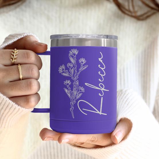 Custom Engraved 15 oz Purple Tumbler Mug being held by a woman with a sample engraving for Rebecca