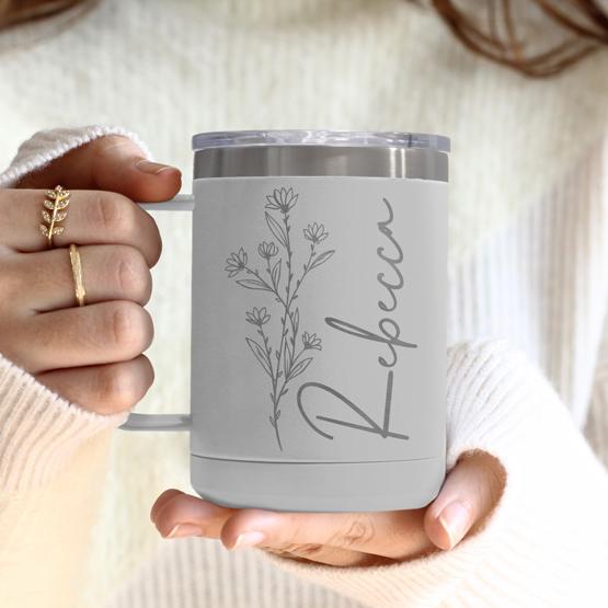 Custom Engraved 15 oz White Tumbler Mug being held by a woman with a sample engraving for Rebecca