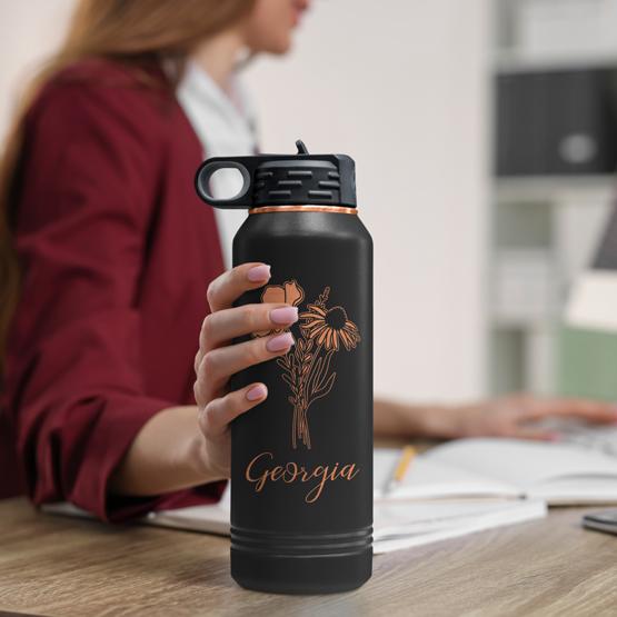 Woman Grabbing Custom Engraved 32 Oz Black with Gold Water Bottle