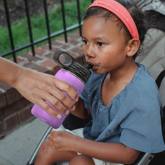 Boy Drinking from Lt Purple Bottle