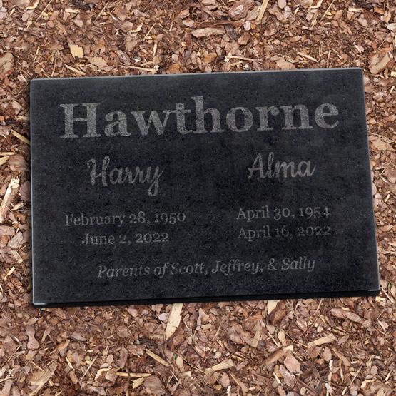 Double Headstone Sitting on Mulch