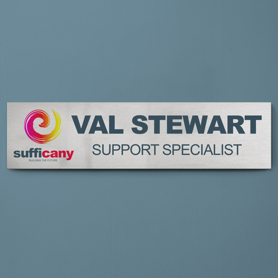 Custom printed aluminum office plate for Val Stewart and is attached to wall outside office door. 