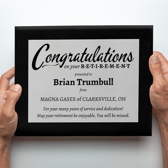 Custom Printed Retirement Plaque with Silver Aluminum Metal on Coated Black Board for Brian Trumbull. 