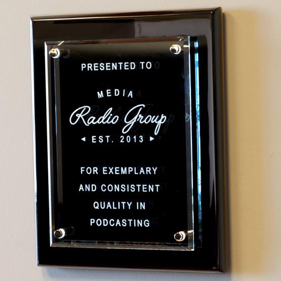 Glass Plaque on Black Piano on Wall