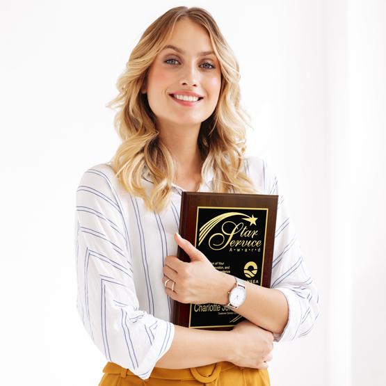 Woman holding an easy to design recognition plaque, laser engrave with gold engraving to elevate the award.