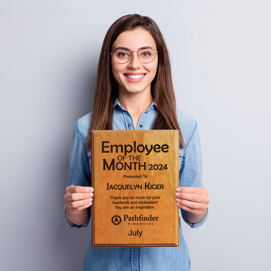Smiling Woman With Brown Hair And Glasses Holding Custom Solid Cherry Plaque Award For Employee Of The Month