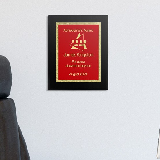 Custom Stainless Steel Plaque Award For Achievement With Black Board And Red Plate With Florentine Border On Office Wall
