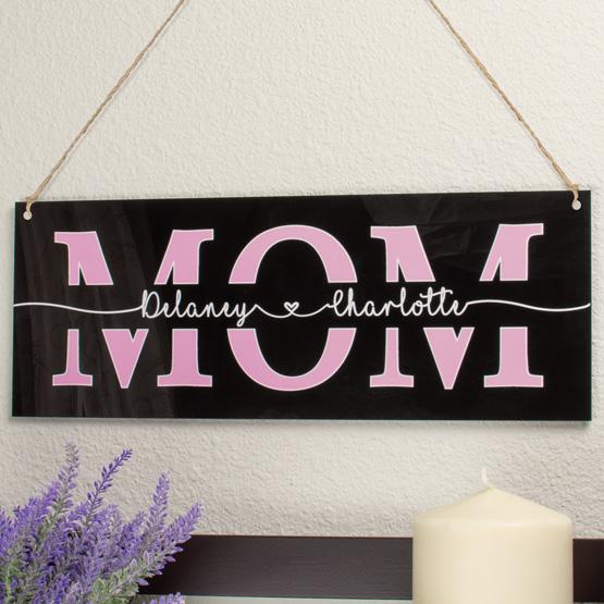 Mom Sign Hanging Above Shelf