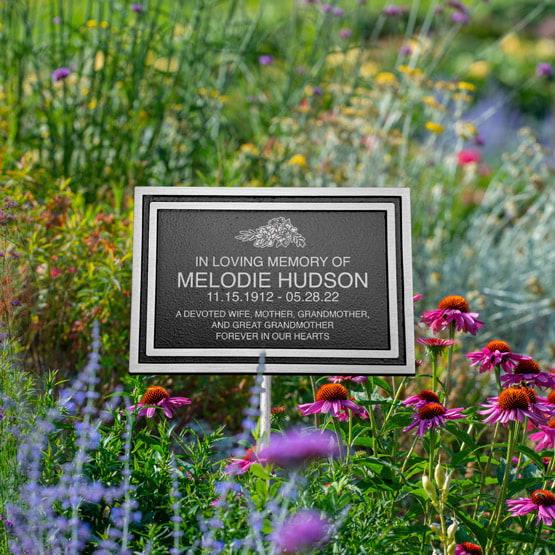Black And Silver Rectangle Cast Aluminum Sign With Stand In Flower Garden Featuring Custom Memorial For Family Member