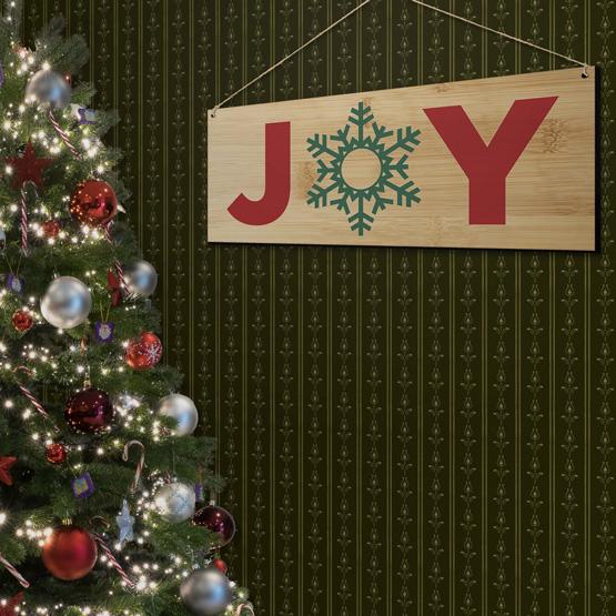 Joy Bamboo Sign hanging on Wall