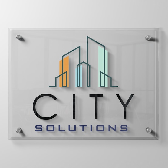 Custom Color Printed Glass Sign affixed to White Wall with Silver Standoffs.