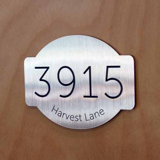 Metal Address Sign on Wood Door