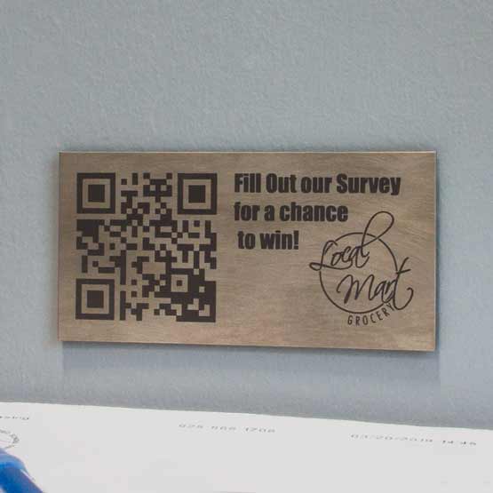 Custom Titanium QR Tag on a Wall