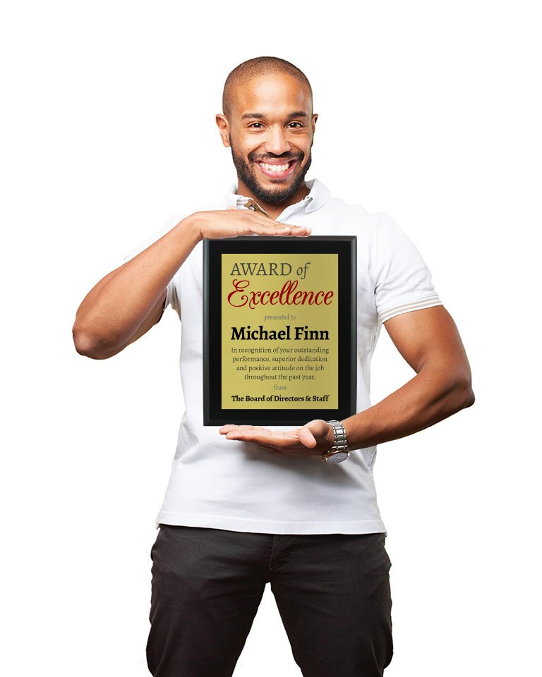 Smiling man holding a sublimated plaque